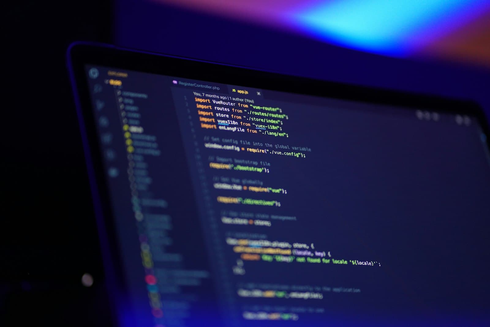 Engineering workspace with code on screen